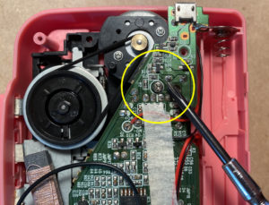 Locate and remove screw to access trimpot