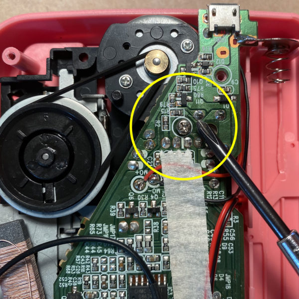 Locate and remove screw to access trimpot